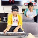 MOST SONGS ARE CONTINUOUSLY PLAYED ON A KEY BOARD WITH BLINDFOLDED
